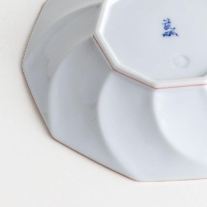 Medium-sized octagonal salad plate with a petal design and bowl shape, outlined in blue and red with a brown rim.