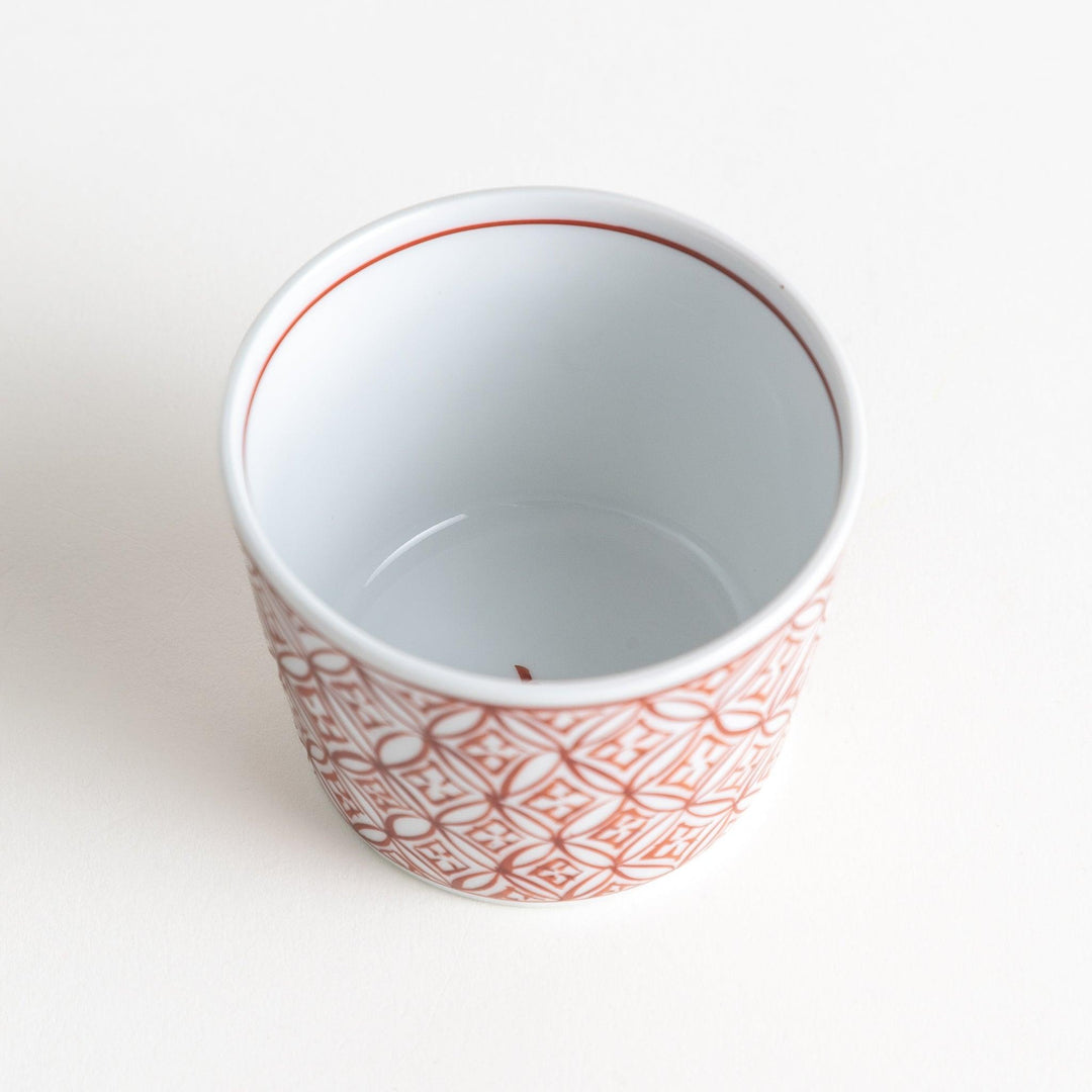 A small condiment bowl adorned with a blue or red geometric lattice pattern, providing a classic and intricate look.