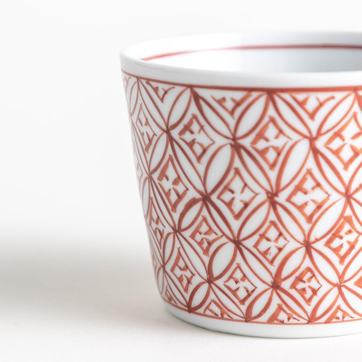 A small condiment bowl adorned with a blue or red geometric lattice pattern, providing a classic and intricate look.