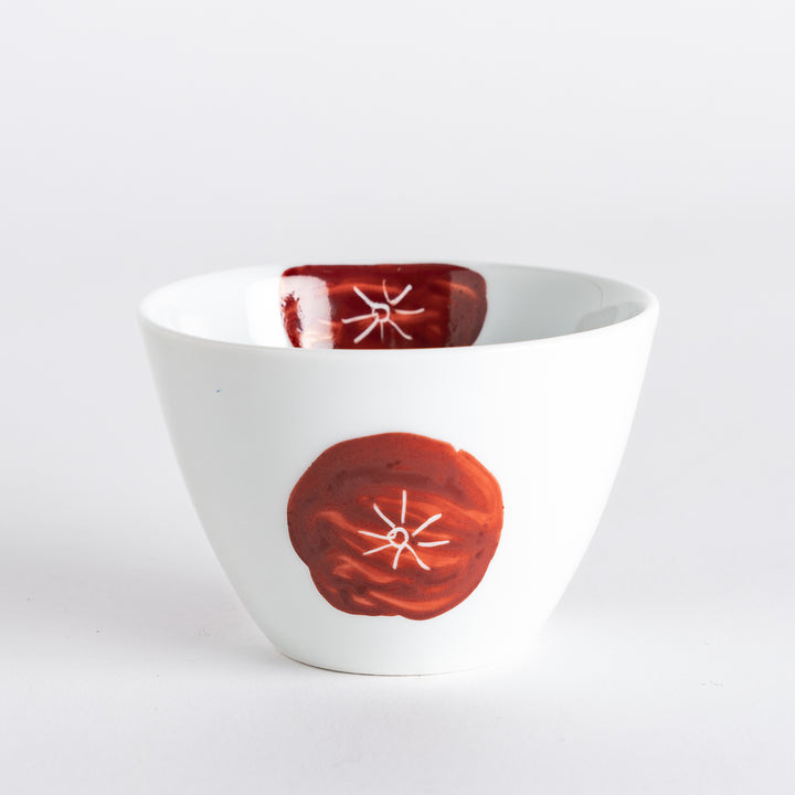 White teacup with a bold red design, offering a stylish and modern touch to your tea-drinking experience.