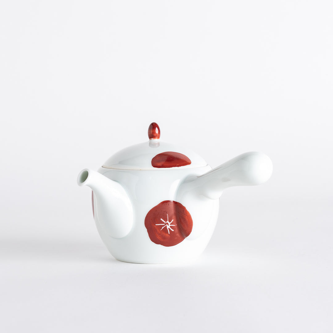 Elegant teapot with a smooth, rounded shape and a rich red design, perfect for adding a touch of color to tea service.