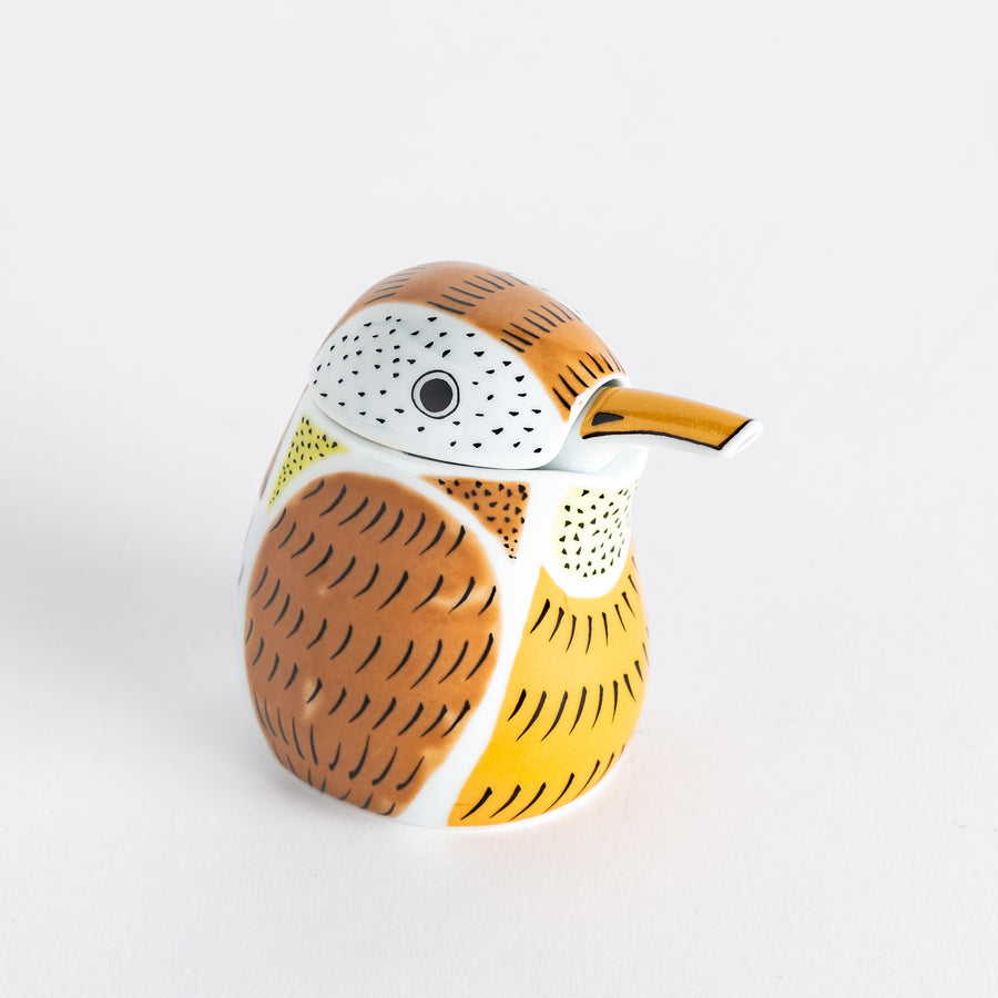 Ceramic soy sauce dispenser designed as a sparrow with a mix of brown, white, and orange tones and detailed feather patterns.