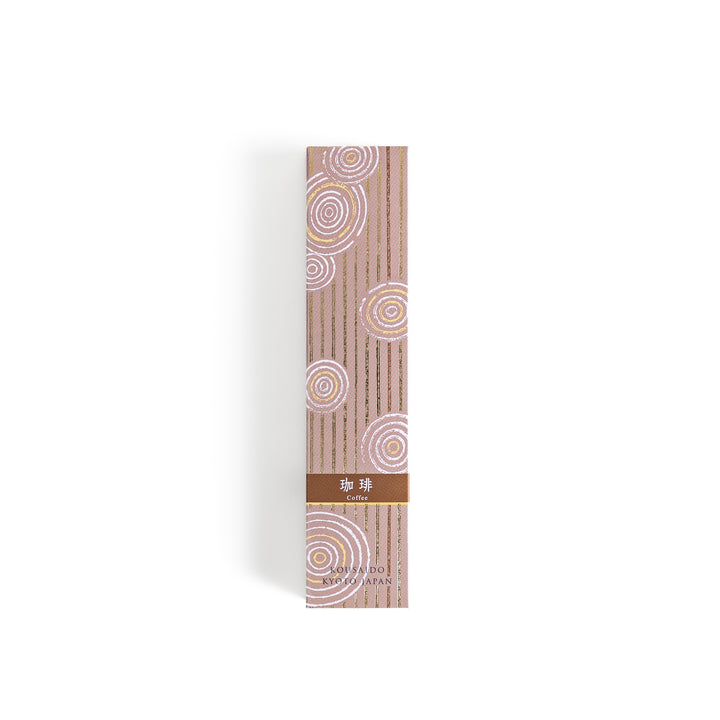 Incense in a light wooden box with rich brown sticks, elegantly packaged in a warm beige design featuring white circular patterns, evoking a soothing coffee aroma.