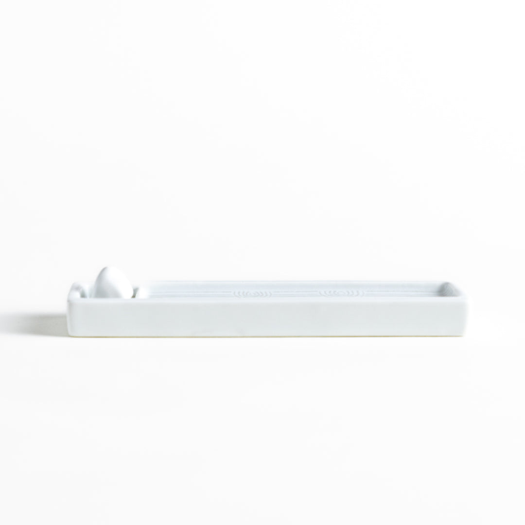 Zen-inspired white ceramic Incense Holder featuring a raked sand pattern.