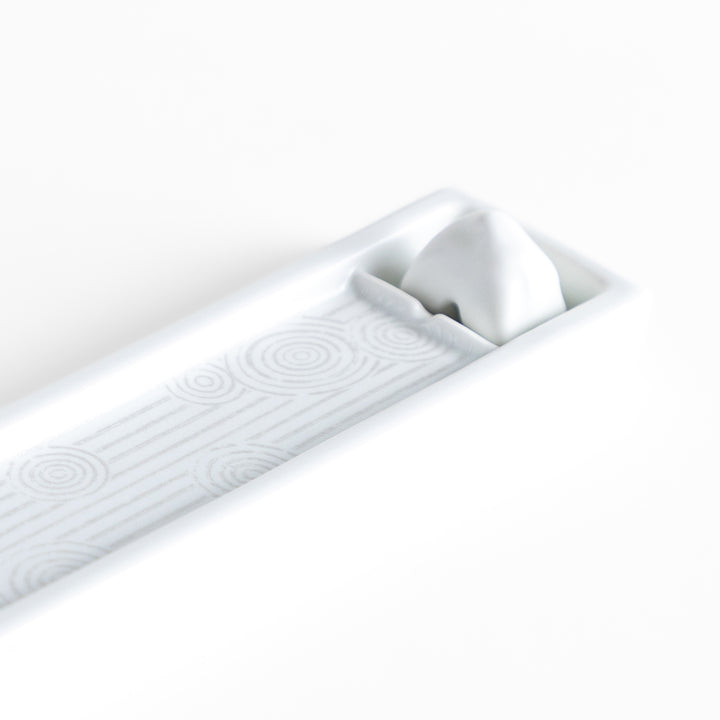 Zen-inspired white ceramic Incense Holder featuring a raked sand pattern.