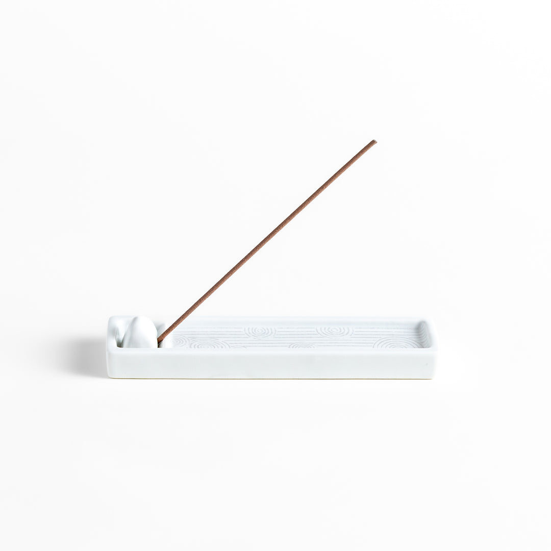 Zen-inspired white ceramic Incense Holder featuring a raked sand pattern.