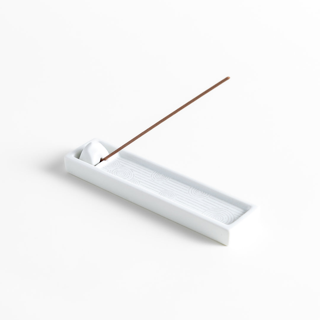 Zen-inspired white ceramic Incense Holder featuring a raked sand pattern.