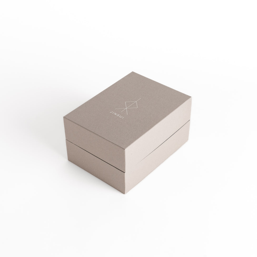 The teapot's packaging box featuring minimalist design, ensuring secure storage and gifting.