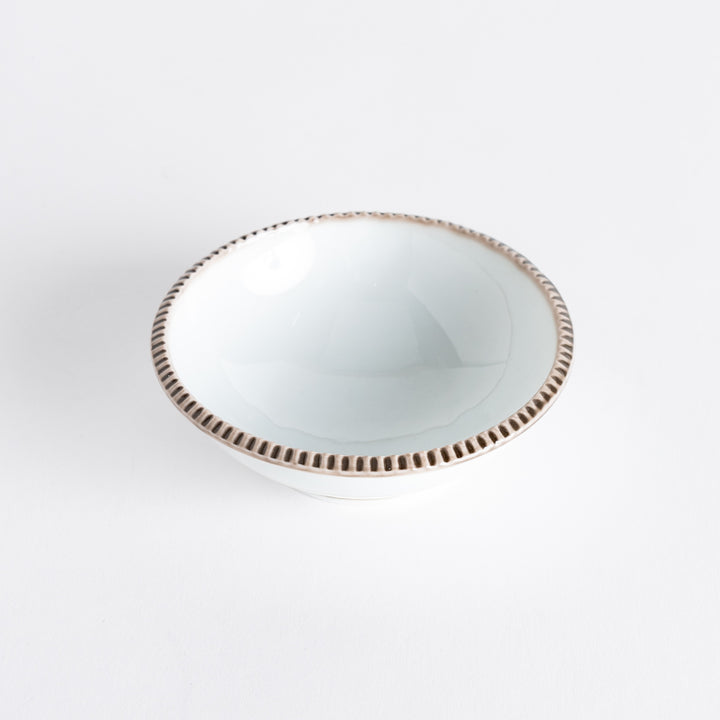 A round white dessert bowl with a rustic scallop-edged border. The border comes in blue, brown, and olive.