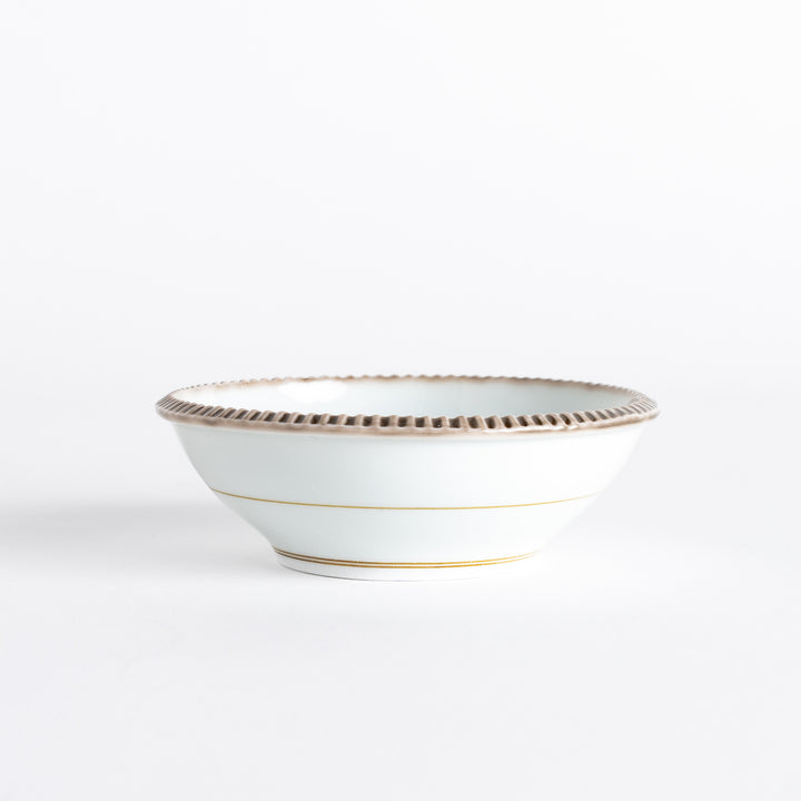 A round white dessert bowl with a rustic scallop-edged border. The border comes in blue, brown, and olive.