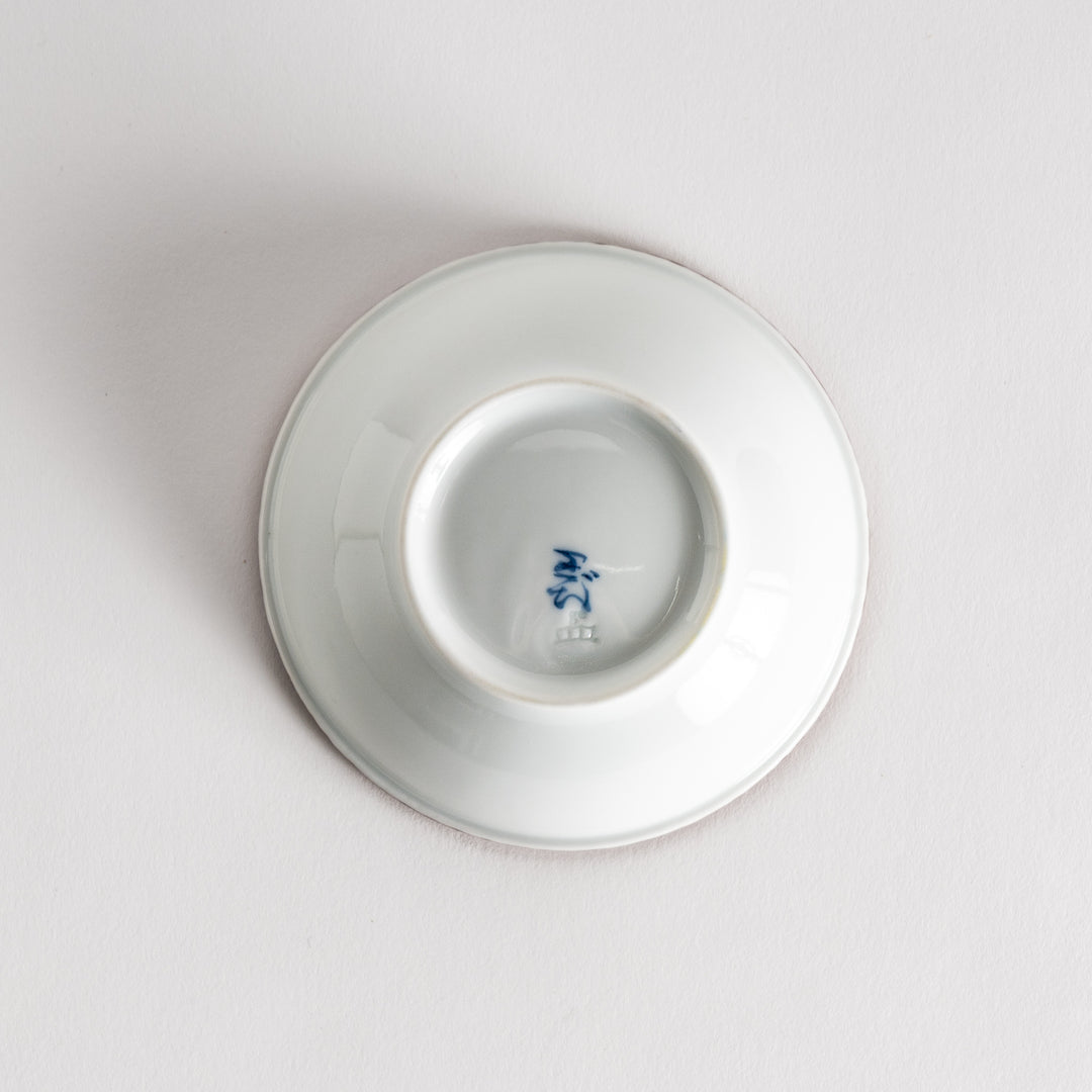 A round white dessert bowl with a rustic scallop-edged border. The border comes in blue, brown, and olive.