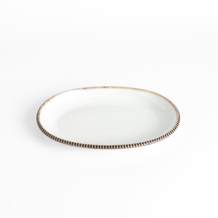 Classic white dinner plate with a unique beaded design, ideal for everyday dining or special occasions.