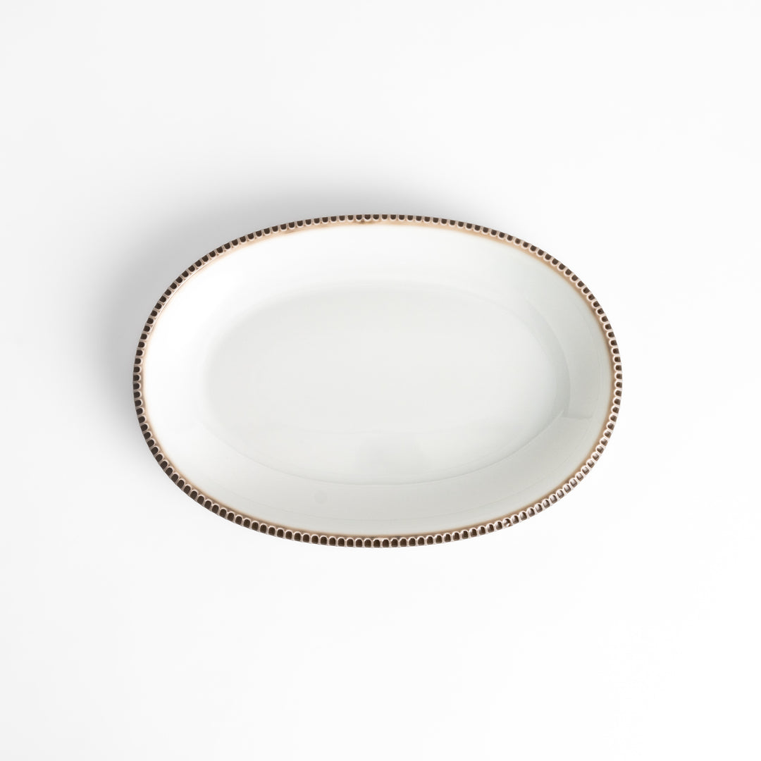 Classic white dinner plate with a unique beaded design, ideal for everyday dining or special occasions.