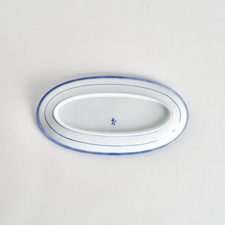 Back view of the oval salad plate, revealing its plain white underside.