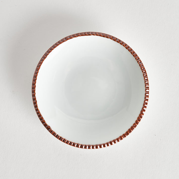 A round white sauce dish with a rustic scallop-edged border. The border comes in blue, brown, and olive.