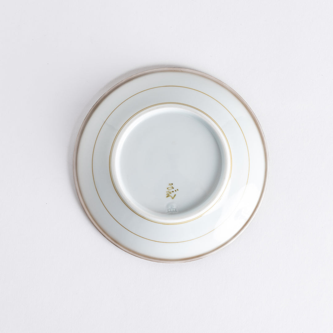 A round white dessert plate with a rustic scallop-edged border. The border comes in blue, brown, and olive.