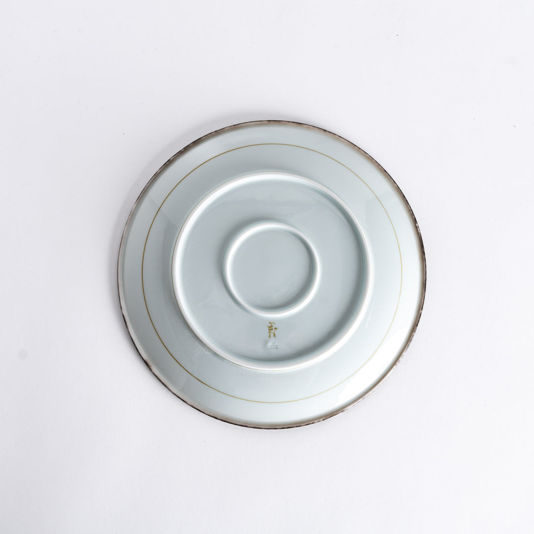 A small porcelain condiment bowl adorned with a blue floral pattern and soft brush strokes.