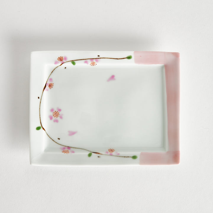 Rectangular dessert plate with a delicate cherry blossom design, featuring soft pink and green accents along the edges.