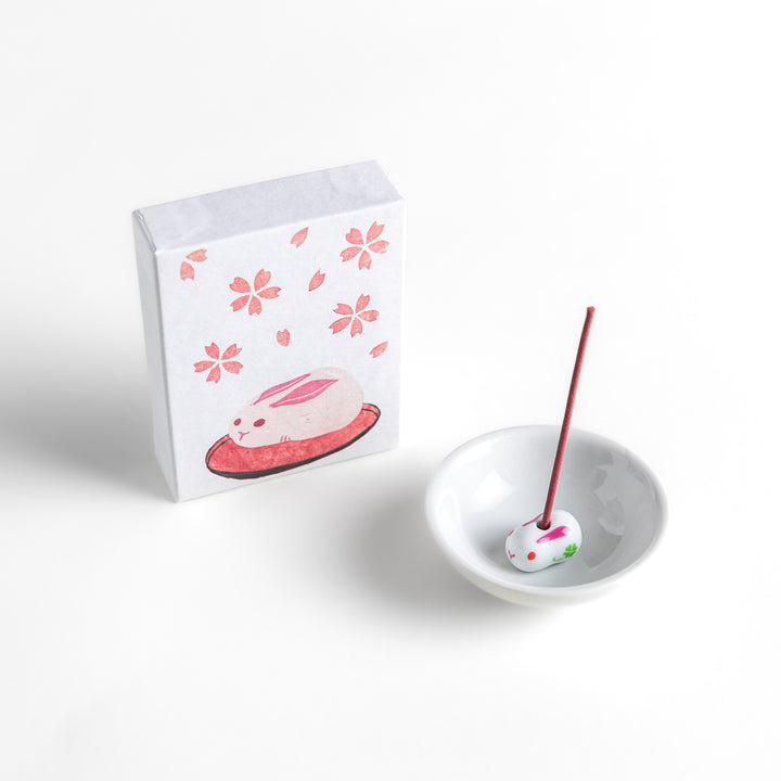 Incense featuring soft pink sticks in a box adorned with cherry blossoms and a rabbit motif, offering a delicate floral fragrance inspired by springtime sakura.