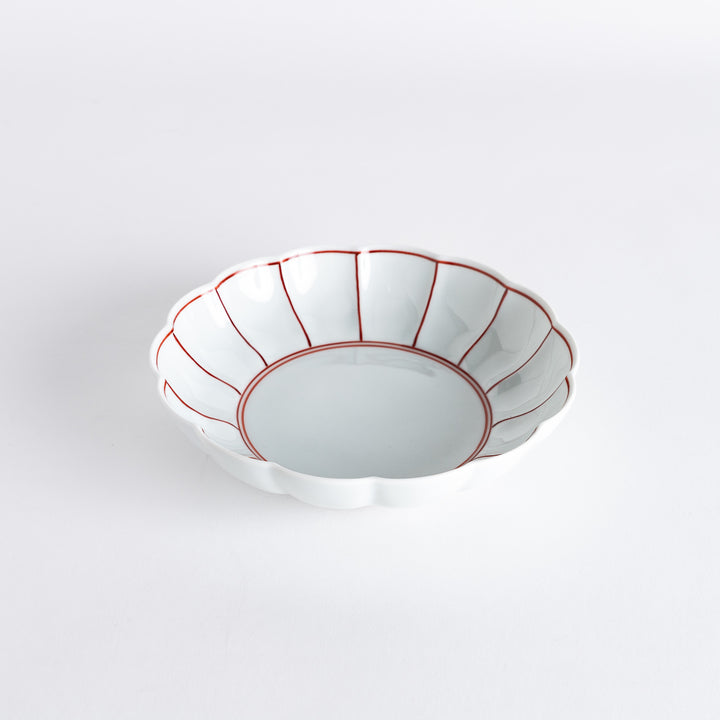 A small round dessert bowl with a delicate blue chrysanthemum pattern and scalloped edges.