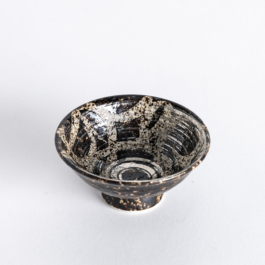 Slightly angled view of the silver rustic finish sake cup, showcasing its textured surface with a spiral design and gold accents inside.