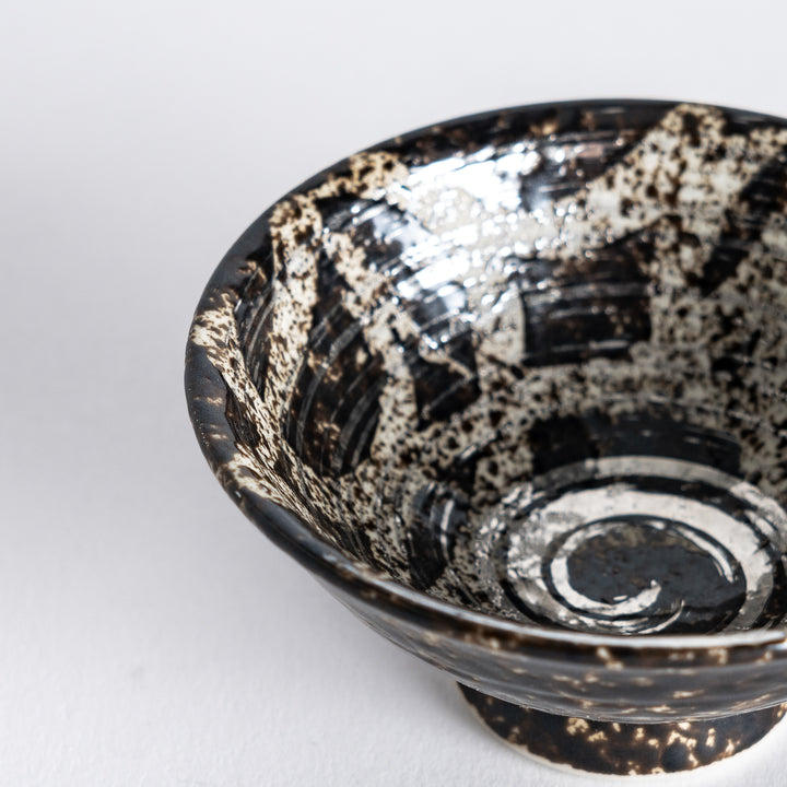 Close-up of the interior of the silver rustic finish sake cup,contrasting textured exterior.