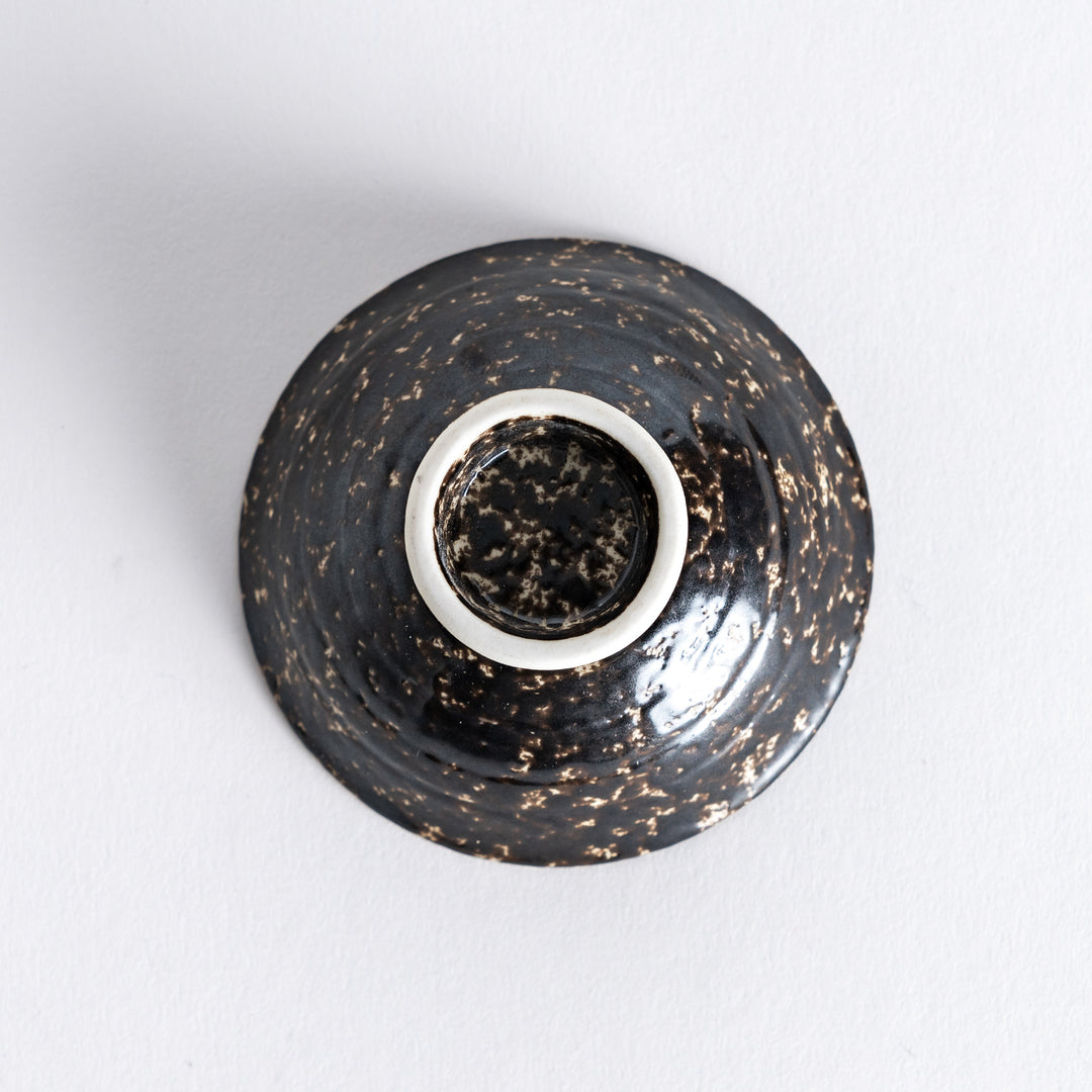 Bottom view of the silver rustic finish sake cup, revealing its smooth base with subtle texture around the edge.