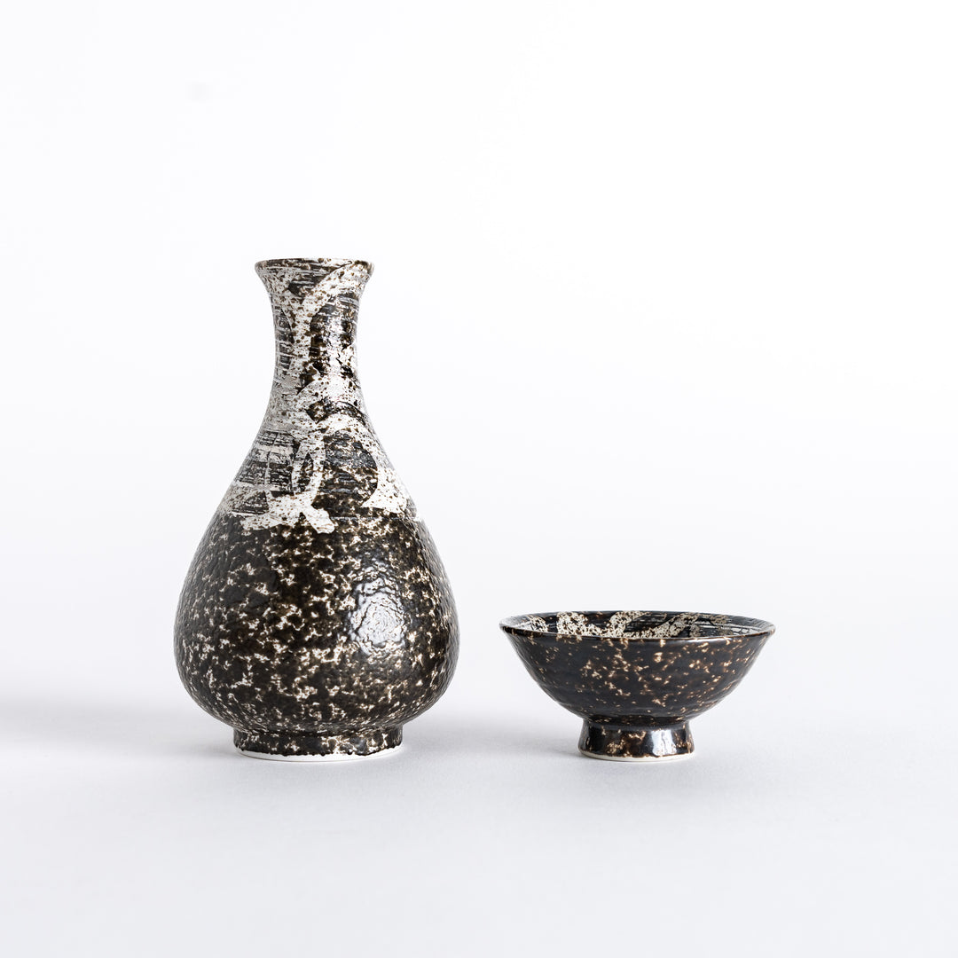 Side view of the rustic finish sake flask and sake cup, displaying the complementary designs of both.