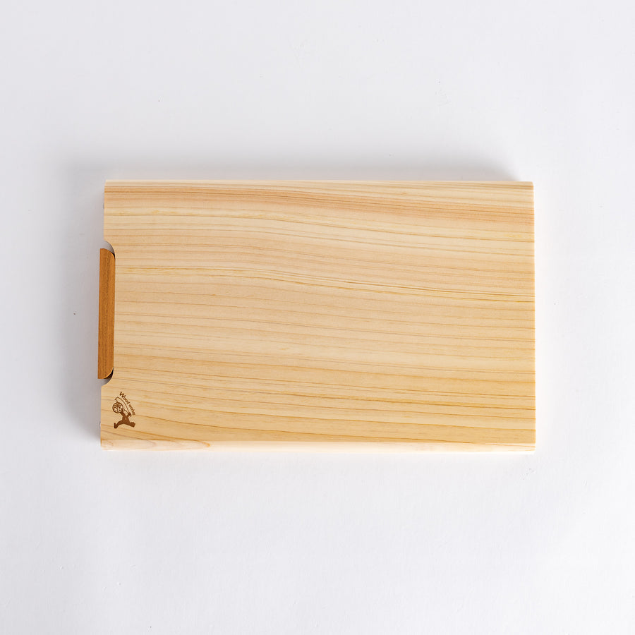 Small hinoki cutting board with smooth surface, featuring a wooden handle for easy handling.