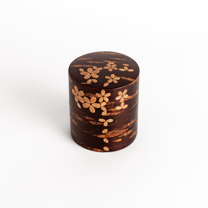 Elegant cherry bark tea canister with a beautiful natural grain and cherry blossom accents, perfect for storing and preserving your favorite tea leaves.