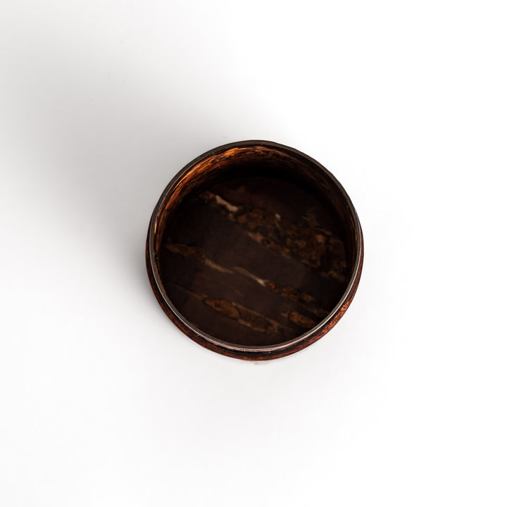 Elegant cherry bark tea canister with a beautiful natural grain and cherry blossom accents, perfect for storing and preserving your favorite tea leaves.