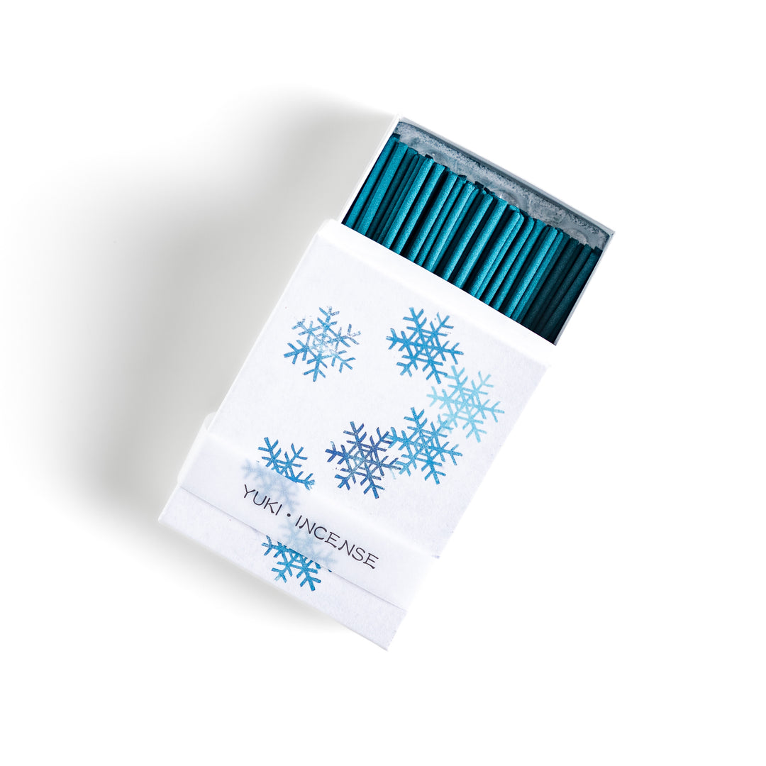 Incense featuring deep blue sticks in a box decorated with delicate snowflake patterns, evoking a crisp and refreshing winter fragrance perfect for relaxation.