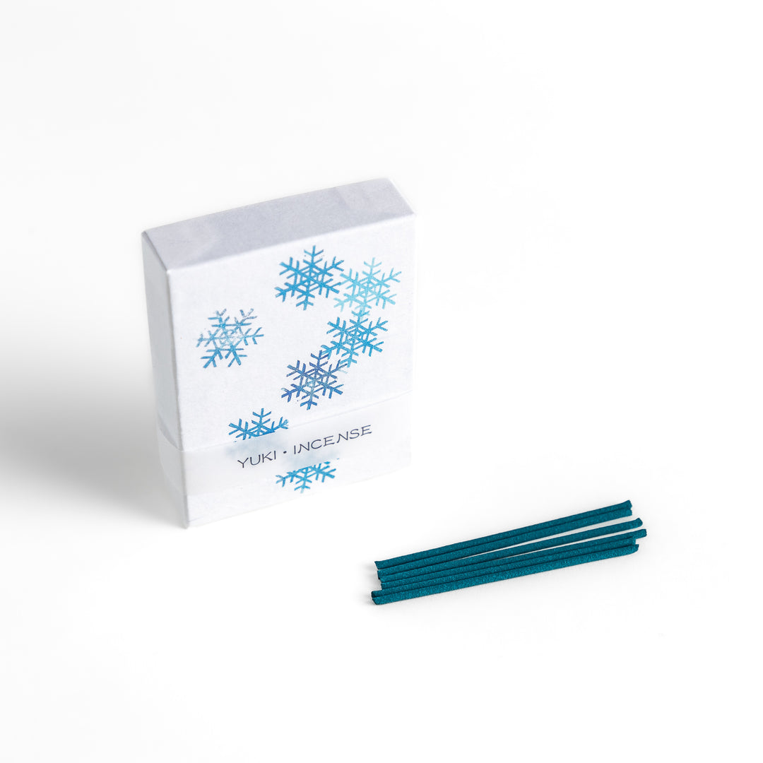 Incense featuring deep blue sticks in a box decorated with delicate snowflake patterns, evoking a crisp and refreshing winter fragrance perfect for relaxation.