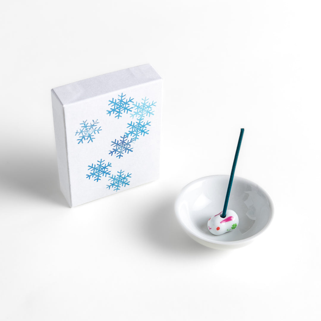 Incense featuring deep blue sticks in a box decorated with delicate snowflake patterns, evoking a crisp and refreshing winter fragrance perfect for relaxation.