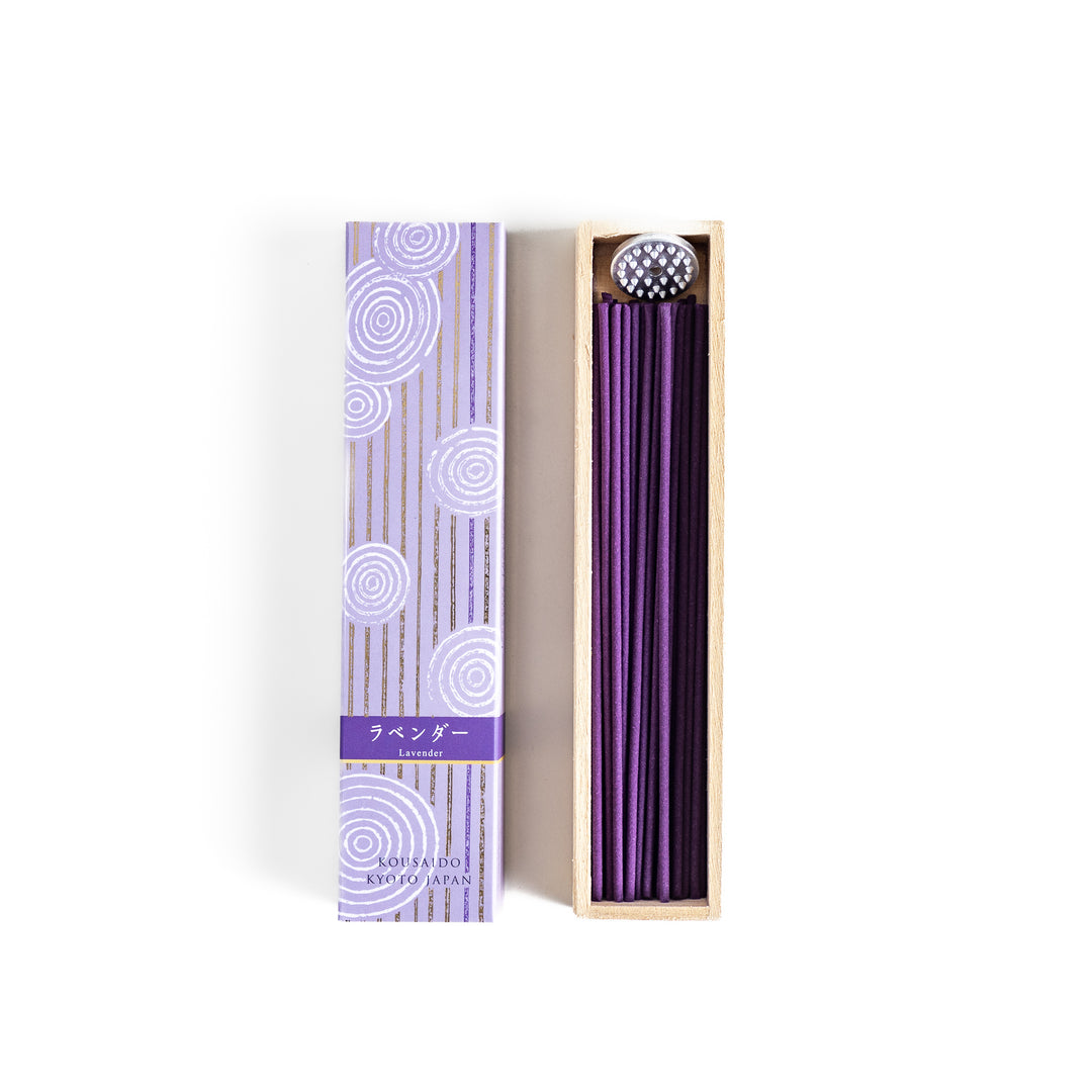 Soothing Lavender Incense in a light wooden box with deep purple sticks, elegantly packaged in a lavender-toned design featuring white circular patterns for a calming ambiance.