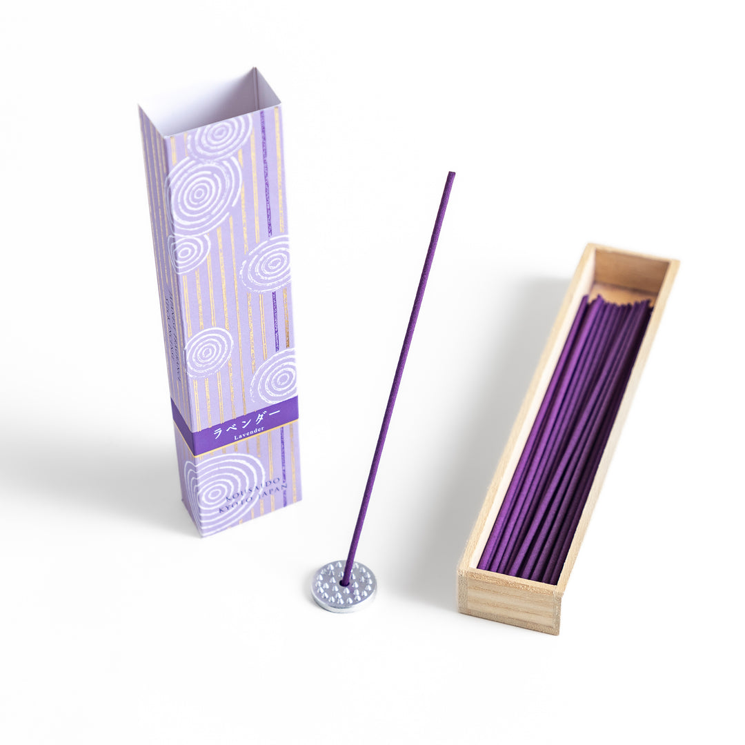 Soothing Lavender Incense in a light wooden box with deep purple sticks, elegantly packaged in a lavender-toned design featuring white circular patterns for a calming ambiance.