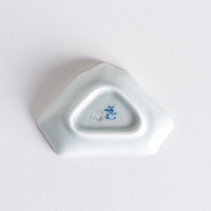 Bottom view of the Mount Fuji-shaped mini sauce dish, showing the unique shape and delicate blue ink design at the base.