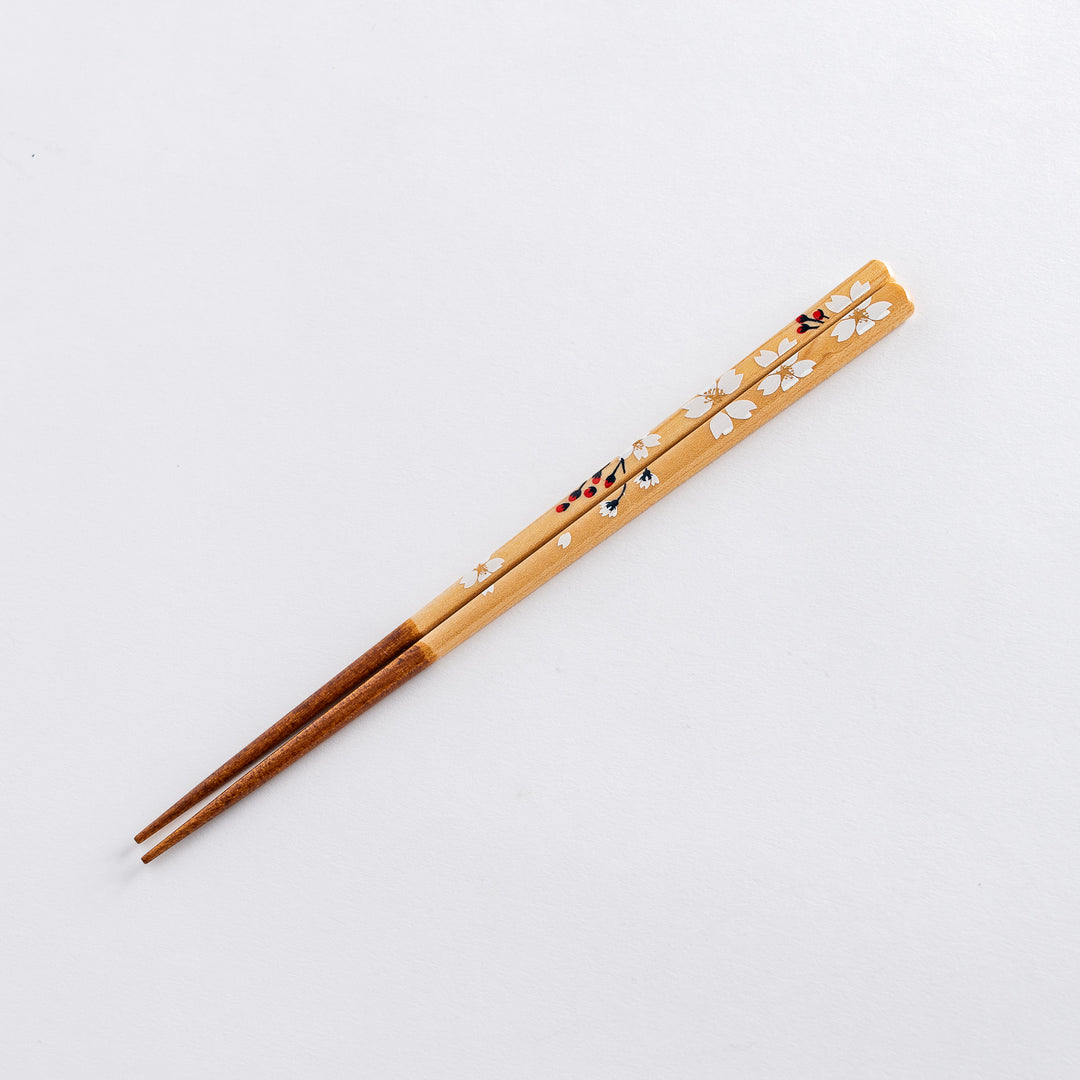 A minimalistic chopstick rest, made of simple natural wood with a soft, smooth texture.