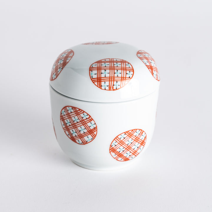 A stylish chawanmushi bowl featuring alternating red stripes and circles, ideal for serving delicate dishes.