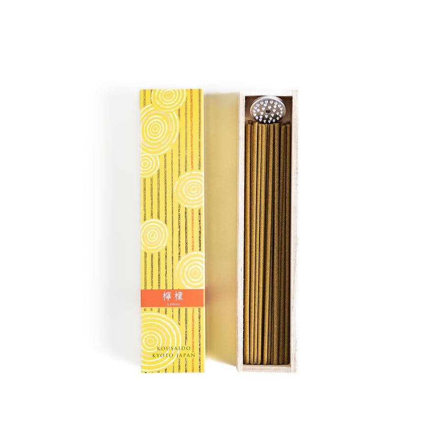 Sunny Lemon Incense in a light wooden box with golden-yellow sticks, elegantly packaged in a vibrant yellow design featuring white circular patterns, evoking a bright and refreshing citrus aroma.