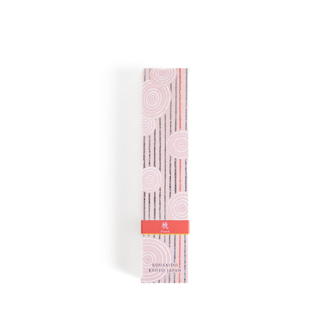 Sweet Peach Incense in a light wooden box with warm brown sticks, elegantly packaged in a soft pink design featuring white circular patterns, evoking a delicate and fruity peach aroma.