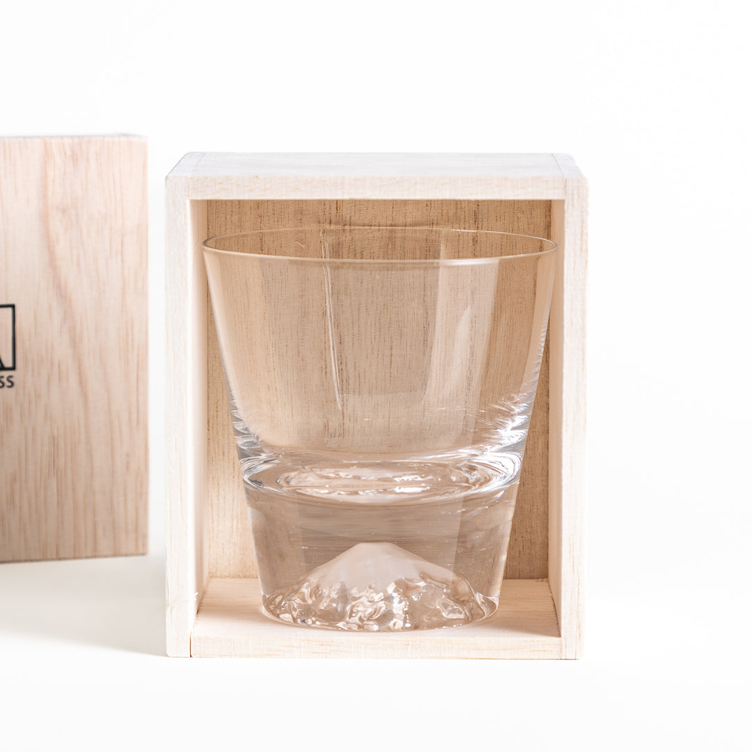 Close-up of the glass, housed inside a wooden box with a visible "EDO GLASS" logo. The glass is displayed with the mountain design clearly visible on the bottom.