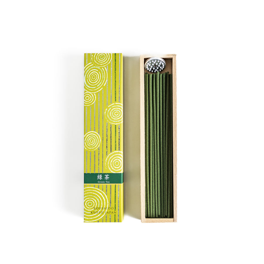 Tranquil Matcha Incense in a light wooden box with vibrant green sticks, elegantly packaged in a yellow design featuring white circular patterns, evoking the calming aroma of green tea.