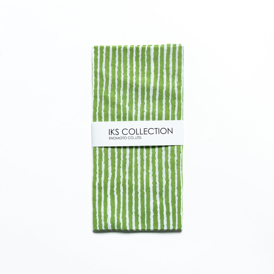 Green hand towel with vertical white stripes, folded with a product sleeve.