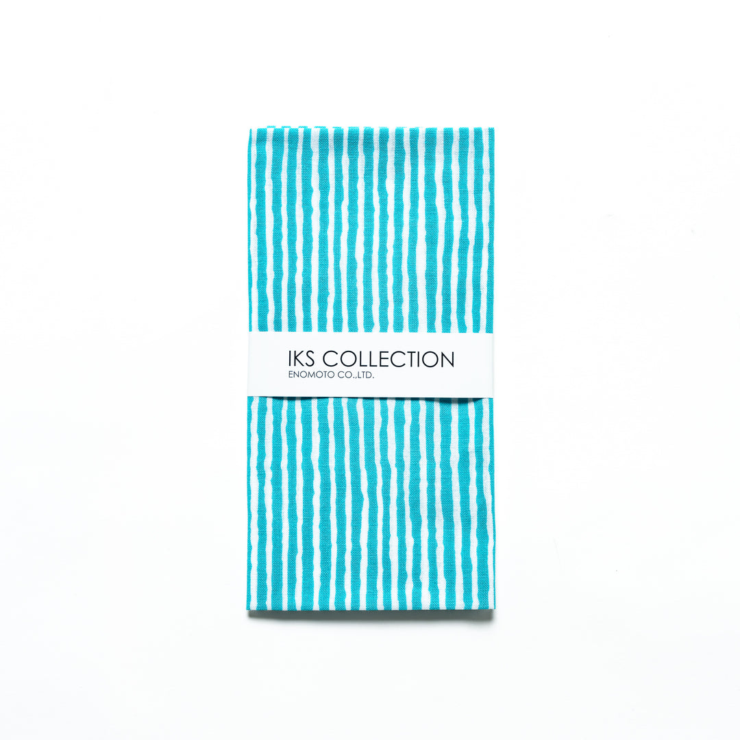 Bright blue hand towel with vertical white stripes, folded with a product sleeve.