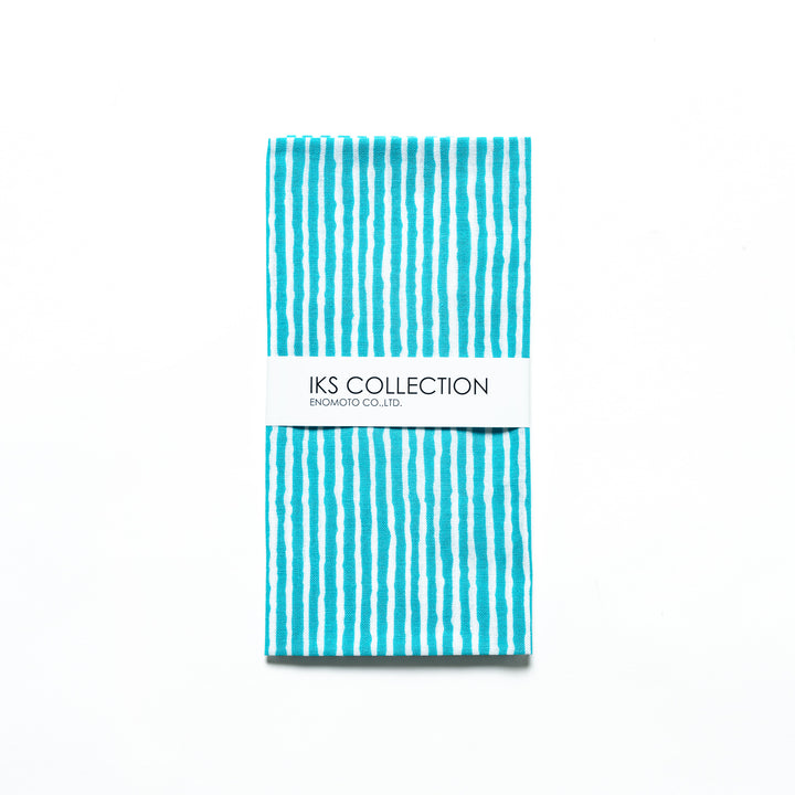 Bright blue hand towel with vertical white stripes, folded with a product sleeve.