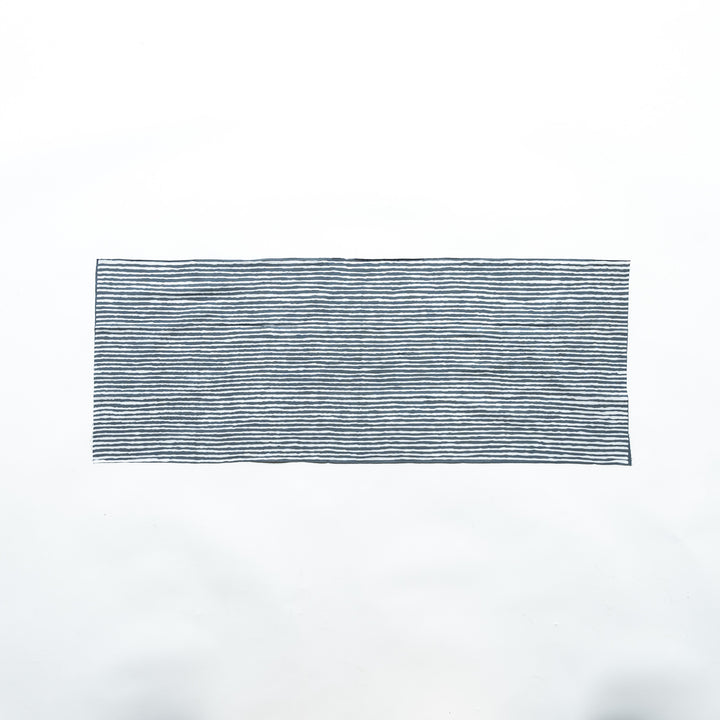 Gray hand towel with vertical white stripes, laid flat for full view.