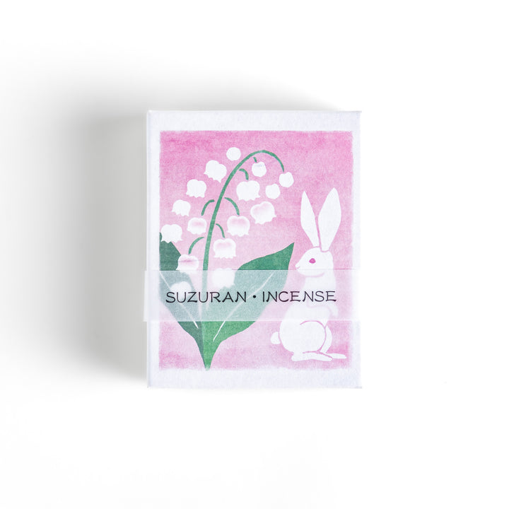 Incense featuring deep green sticks in a box decorated with an elegant lily of the valley and rabbit illustration, offering a delicate and soothing floral fragrance.