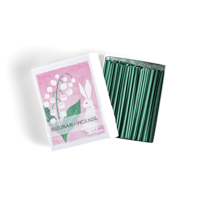 Incense featuring deep green sticks in a box decorated with an elegant lily of the valley and rabbit illustration, offering a delicate and soothing floral fragrance.