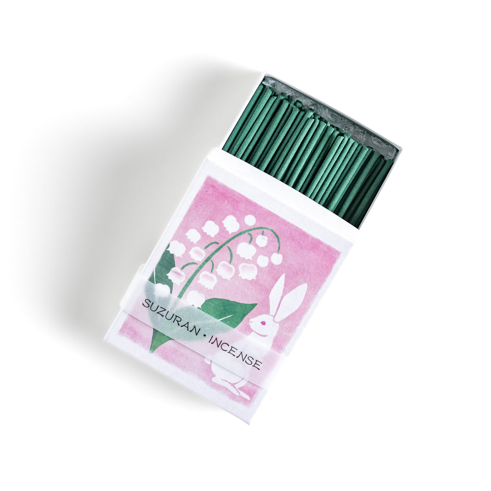 Incense featuring deep green sticks in a box decorated with an elegant lily of the valley and rabbit illustration, offering a delicate and soothing floral fragrance.